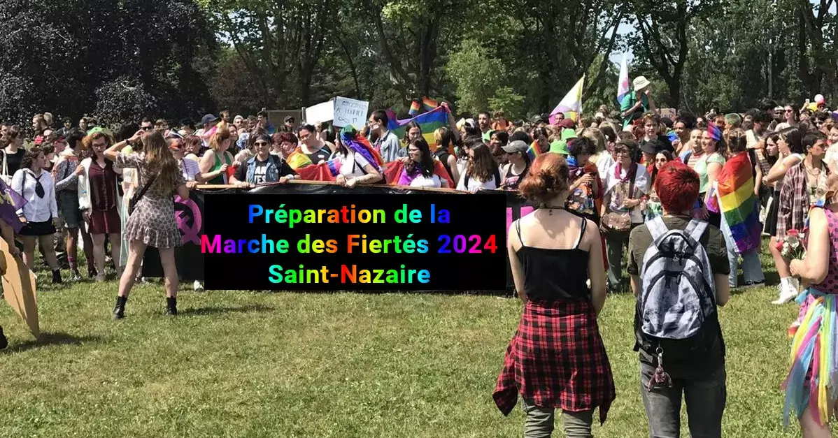 photo de la marche des fiertés 2023 de Saint-Nazaire, éditée pour que la banderole montre "organisation marche des fiertés 2024"
